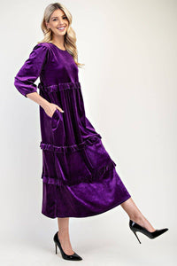 Velvet dress in purple side view. 