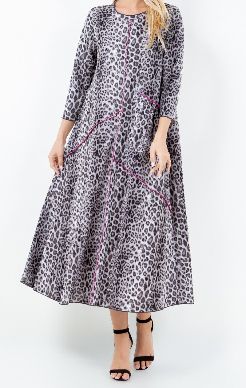 Photo shows flowy fit of Pretty in Leopard Dress in Gray Leopard Print with Pink Stitch Detail and Front Pocket