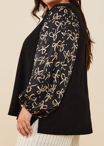 Side View of Black Color - Bow Waltz Top - Textured Knit Fabric - Round Neckline - Long Sleeves - Loose and Comfy Fit