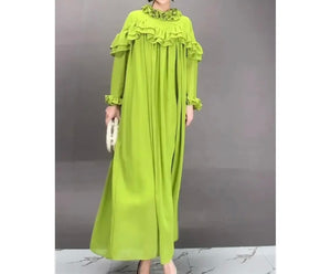 Green ruffled dress. Ruffles around top of dress and over sleeves 