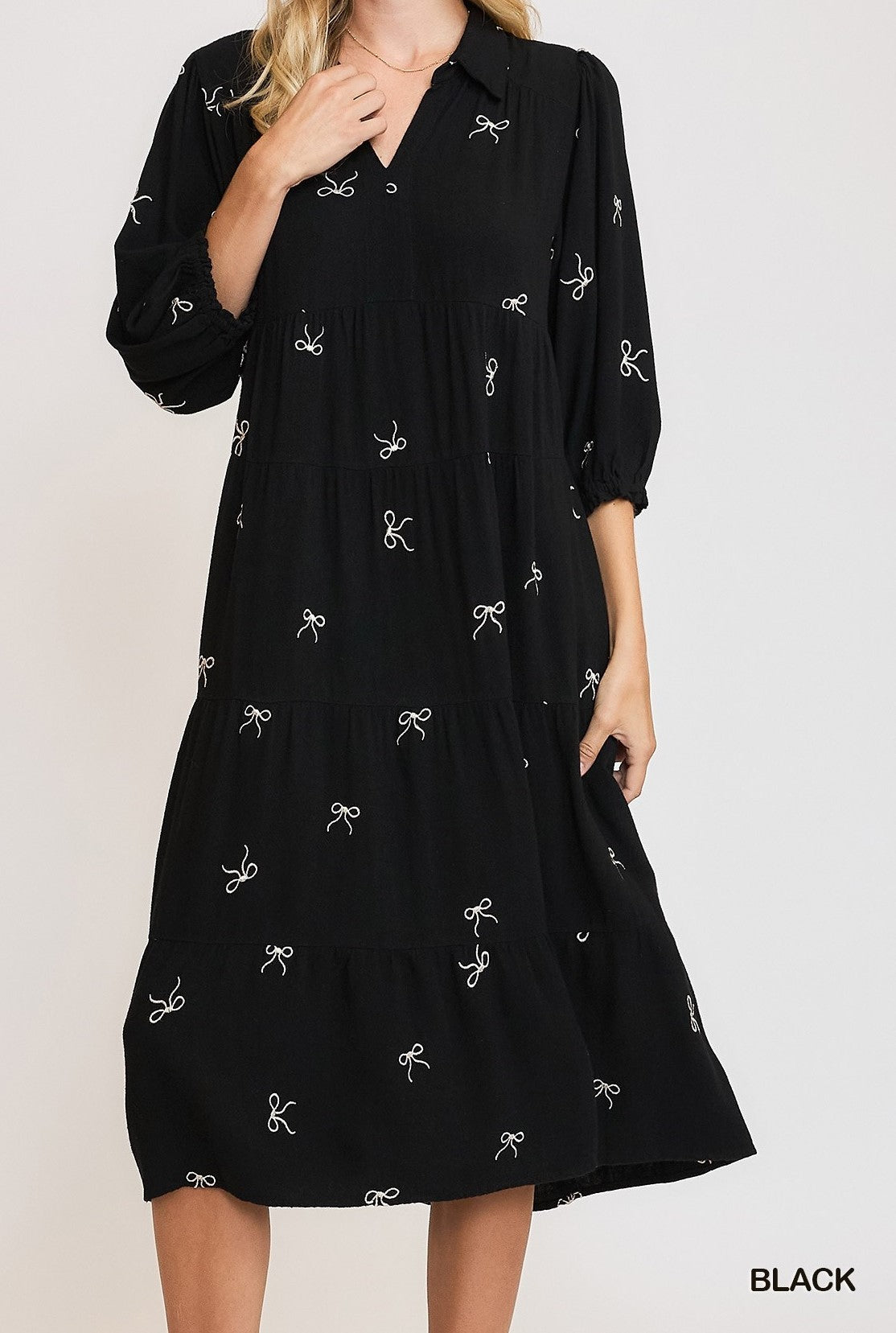 Black Color - Bows Galore Dress - Midi Length - Tiered Style - 3/4 Length Sleeves - V-Neck Neckline - Bow Print Throughout