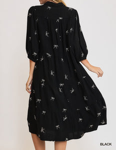 Back View of Black Color - Bows Galore Dress - Midi Length - Tiered Style - 3/4 Length Sleeves - V-Neck Neckline - Bow Print Throughout