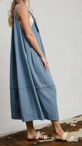 Side View of Denim Color - Darling in Denim Overall Dress - Midi Length with Smocked Neckline, Back Bow Detail, & Pockets