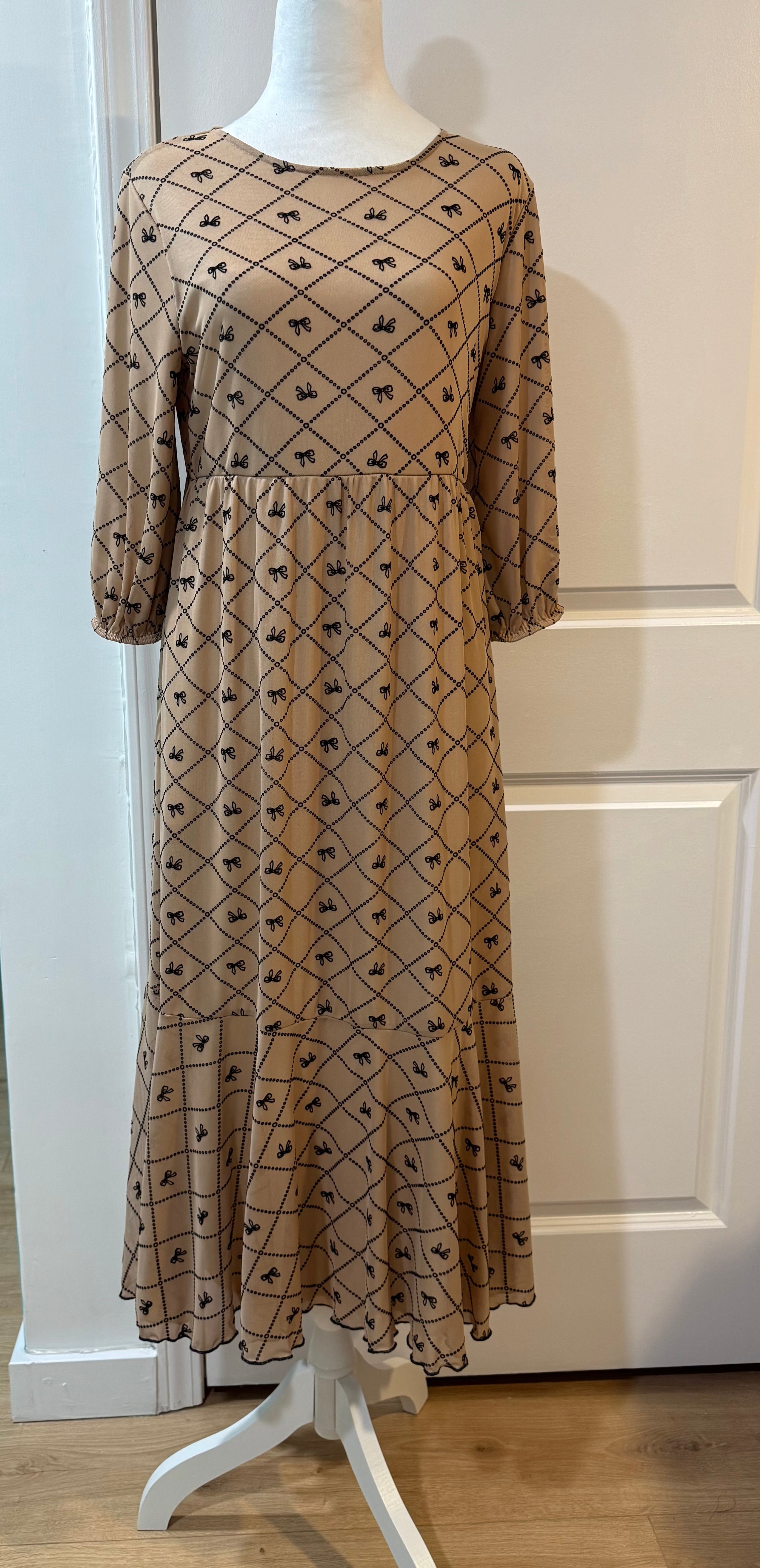 Bow Allure Dress In Beige. Sizes S - 3X