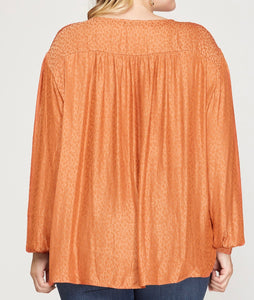 Back View of Rust Orange Color - V-Neck Neckline, Long Dolman Sleeve Top with Surplice Crossover Bodice Style, Shiny Leopard Print, Wide Cuffs with Buttons on Sleeves, Side Slits on Bottom of Top