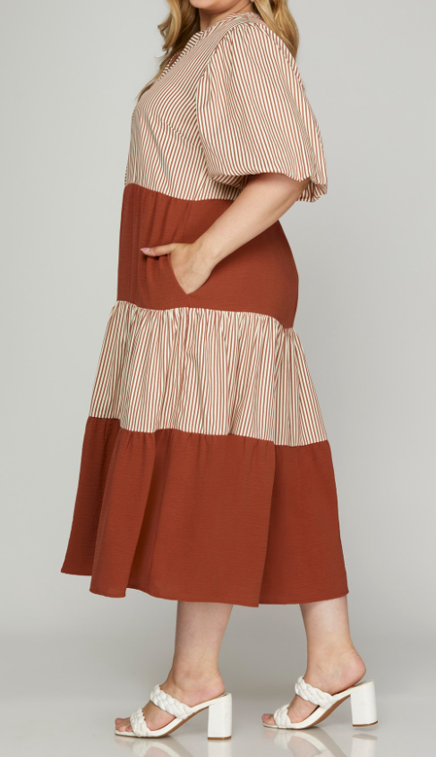 Plus Size - Side View of Rust Color - Midi Length Dress with 1/2 Puff Sleeves, Tiered Style, Alternating Rust/Cream Striping and Solid Rust Tiers