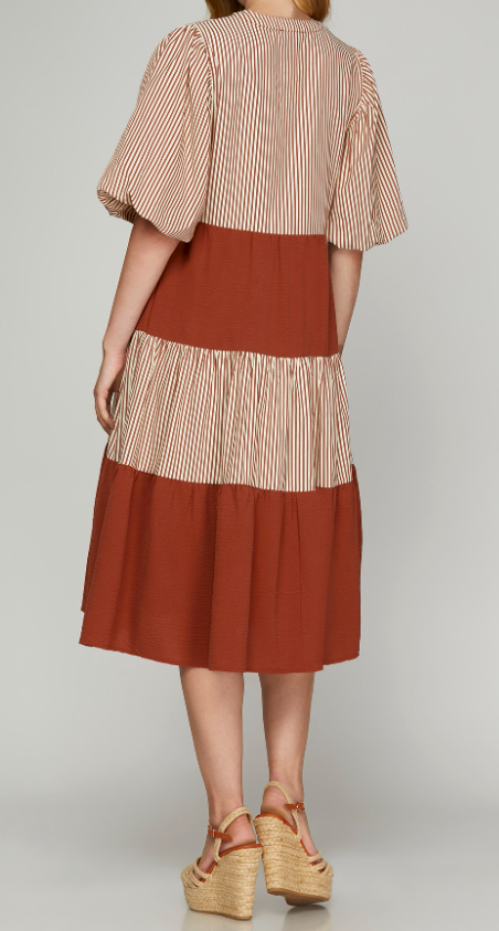 Regular Size - Back View of Rust Color - Midi Length Dress with 1/2 Puff Sleeves, Tiered Style, Alternating Rust/Cream Striping and Solid Rust Tiers