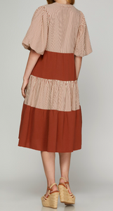 Regular Size - Back View of Rust Color - Midi Length Dress with 1/2 Puff Sleeves, Tiered Style, Alternating Rust/Cream Striping and Solid Rust Tiers